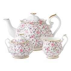 a tea set with pink flowers on it