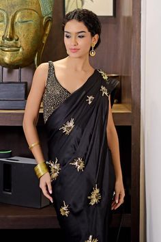 Black pre-draped saree with pleated draped details, attached pallu, all over stardust pattern, contrast metallic sequins and beads hand embroidery. Paired with embroidered padded blouse. - Aza Fashions Glamorous Embellished Pre-draped Saree For Celebrations, Party Silk Pre-draped Saree With Pearl Embroidery, Traditional Pre-draped Saree With Pearl Embroidery For Evening, Hand Embellished Party Blouse With Traditional Drape, Festive Embellished Draped Blouse, Elegant Embroidered Draped Saree, Embellished Silk Saree For Party, Embellished Silk Blouse Piece For Reception, Elegant Pre-draped Saree With Pearl Embroidery For Evening