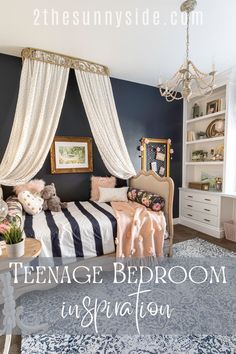 the bedroom is decorated in navy and white with gold accents, striped bedding, and curtains