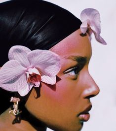 a woman with a flower in her hair