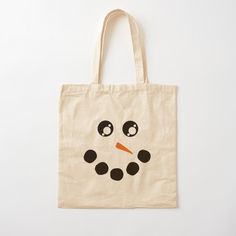 a tote bag with a snowman drawn on it's face and eyes