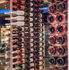 a wine rack filled with lots of bottles