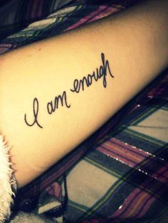 someone has their arm tattooed with the words i love you in cursive writing