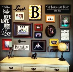 a white dresser topped with lots of framed pictures