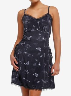 Looking for a moody mini dress to fit the moodiness of the winter season? This Daisy Street style is black velvet with lace trim  black lace-up detail on the sides and an allover print of butterflies and cherubs. It also has adjustable straps.95% polyester; 5% spandexWash cold; dry lowLength: 35"ImportedListed in junior sizesModel is 5'9"Model wears size Small Black Velvet Gothic Mini Dress, Black Sleeveless Dress With Butterfly Print, Sleeveless Black Dress With Butterfly Print, Black Fairy Grunge Mini Dress For Spring, Fairy Grunge Black Mini Dress For Spring, Black Butterfly Print Spring Dresses, Black Butterfly Print Dress For Spring, Black Butterfly Print Dresses For Spring, Cutesy Outfit