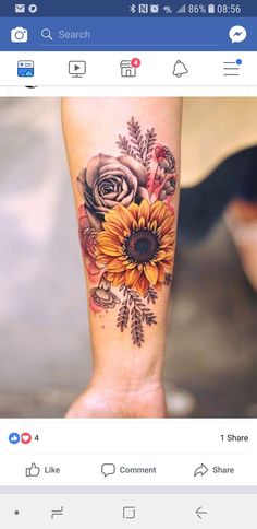 a woman's arm with a sunflower tattoo on it