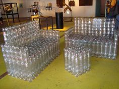 two plastic bottles stacked on top of each other with the words recycled plastic bottle chairs