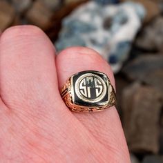 This antique 1927 class ring features a black enamel center with the letters SPS in gold. The ring has a pierced open work floral motif decorating the shoulders and gallery. It is crafted of 10k yellow gold and is currently a size 7.75. There is a small amount of enamel loss in the top right corner of the center but this is difficult to see. Engraved 14k Black Gold Jewelry, Engraved Black 14k Gold Jewelry, Black 14k Gold Engraved Jewelry, Classic Black Enamel Ring For Gift, 14k Gold Black Enamel Ring For Anniversary, Black Heirloom Ceremonial Jewelry, Black Heirloom Jewelry For Ceremonial Occasions, Black Heirloom Jewelry For Ceremonial Use, Antique Engraved Enamel Ring For Formal Occasions