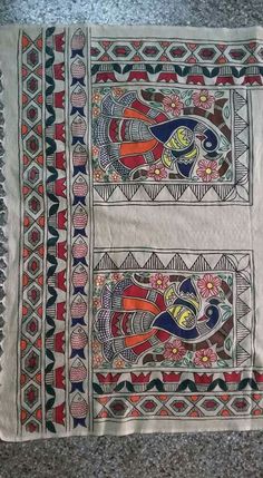 an embroidered cloth with colorful designs on it