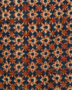 an orange and blue pattern on fabric