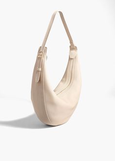 AUGUSTINA HOBO IN DARK IVORY ANGLED VIEW Fall Handbags, Belt Accessories, Oliver Peoples, Zip Top, The Body, Pebbled Leather, Clean Lines, Calf Skin, Carry On