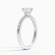 a diamond engagement ring on a white background