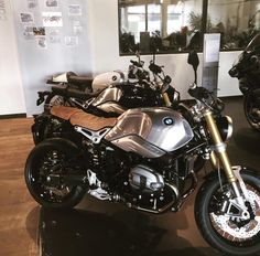 two motorcycles parked next to each other on display