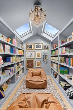 a room filled with lots of books and furniture