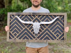 Discover the perfect blend of rustic charm and artistic flair with our Aztec Inspired Geometric Wood Wall Art. This unique piece features a captivating quilt pattern, meticulously handcrafted from high-quality wood, and a striking steel mounted longhorn, adding a touch of Western allure to any space. Our Geometric Wood Wall Decor is not just a piece of art; it's a conversation starter. The intricate quilt pattern draws the eye, while the steel longhorn mounted on 1-inch standoffs adds depth and dimension, creating a stunning visual effect. Whether you're looking to enhance your living room, bedroom, or office, this Handcrafted Wall Art is sure to make a statement. Its rustic appeal makes it a perfect fit for a variety of home decor styles, from Western to Boho. Each piece of our Aztec Wood Intricate Quilt, Diamond Quilt Pattern, Aztec Wall Art, Geometric Wood Wall Art, Geometric Wood Wall, Quilt Pattern Book, Barn Quilt Patterns, Wall Accent, Handcrafted Decor