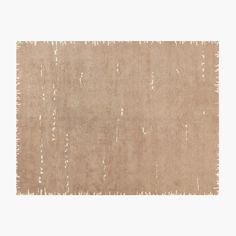 an area rug with white paint on it in beige tones, including the edges of two rectangles