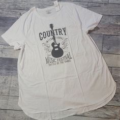 New With Tags. Super Cute And Festive Shirt. Country Music Festival With Guitar. Lightweight Material But Not See Through. Longer Tunic Length In The Back Gives Great Coverage. Sizes Are As Followed.. 18/20 Pit To Pit Is 25 Inches. Across The Bottom Is 27.5 And Top To Bottom Is 30. 22/24 Pit To Pit Is 27. Across Bottom Is 30 And Top To Bottom Is 32.5 Bin9 348, 49, 50, 51, 52 Music-themed Relaxed Fit Tops For Summer, Music-themed White Relaxed Fit Top, Spring Cotton Tops With Music-themed Style, Spring Music-themed Cotton Tops, White Cotton Music-themed Top, White Music-themed Cotton Top, White Music-themed Top For Concerts, Music-themed White Cotton Top, White Relaxed Fit Top For Music Festival