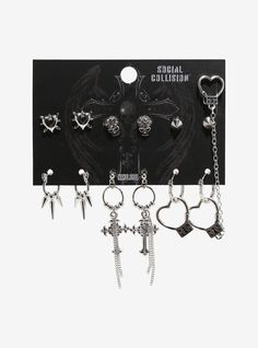 Keep your earrings on lock with this edgy set! It features heart-shaped locks with a matching cuff  studs of skulls  spikes and hearts  plus drop pieces of spikes and gothic crosses. Grunge Accessories Earrings, Grunge Jewellery Earrings, Gothic Accessories Jewellery, Alt Earrings, Emo Earrings, Social Collision, Earrings Emo, Edgy Bracelets, Emo Jewelry