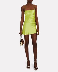 Cut from vivid green silk charmeuse the label's Suna mini dress channels '90s minimalism with a slip silhouette that reveals a sultry lace-up back.   Fabric: 100% silk.   Lace-up back closure.   Imported.       Length from shoulder to hem: 35".   Model is wearing size P.  Model height 5'10", bust 30", waist 23", hips 33". Backless Satin Mini Dress With Boning, Spring Mini Dress With Boning, Spring Mini Dress With Boning For Date Night, Sleek Fitted Bias Cut Mini Dress, Sleek Fitted Mini Dress With Bias Cut, Green Square Neck Mini Dress For Party, Green Mini Dress With Square Neck For Party, Summer Satin Mini Dress With Boning, Chic Spring Mini Dress With Boning