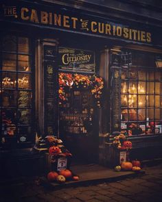 an image of a store front with pumpkins on the outside and candles in the windows