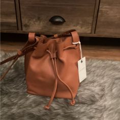 Nwt Lucky Brand Leather Crossbody Purse. This Will Be A Great Addition To Your Fall Wardrobe. This Is A Small Bucket Style Bag. Great For Holding Your Phone, A Small Wallet And Some Of Your Favorite Necessities For A Night Out On The Town. Casual Leather Bucket Bag In Cognac, Chic Brown Bucket Bag With Snap Closure, Casual Cognac Leather Bucket Bag, Everyday Bucket Bag With Snap Closure, Tan Leather Shoulder Bag For Spring, Casual Work Bags With Snap Closure, Casual Workwear Bag With Snap Closure, Brown Leather Crossbody Purse, Crossbody Saddle Bag