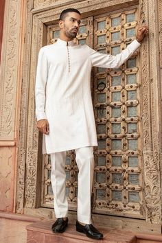 White kurta with pearl embroidery in abstract vertical lines. Paired with a pant. - Aza Fashions Traditional White Fitted Pant Set, Traditional Fitted White Pant Set, Traditional White Pant Set For Festive Occasion, Festive White Pants With Chikankari Embroidery, Traditional White Pant Set For Wedding, Traditional White Pants For Wedding, Elegant White Festive Pants, White Pants For Eid, Festive White Pant Set For Wedding