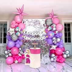 a birthday party with balloons and decorations