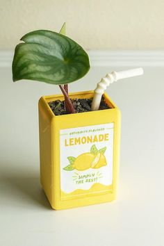 a small yellow box with a lemonade stick sticking out of it's side