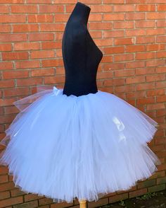 "This listing is for a Solid White 2 tier bridal tutu. Please note this listing is for a stark white tutu, the lighting makes them appear to be different. The photos show the 19-24\" length range with a longest layer of 23\" and top layer of 18\". *If larger sizes are needed please contact me for the link to that listing. Thank you for shopping with Princess Tutus Boutique. If you have any questions please feel free to convo us at anytime and we will get back with you just as soon as possible. W Fitted White Tutu Dress With Tulle Skirt, White Tulle Tutu Dress With Ruffles, Affordable White Tutu Dress For Dress-up, Playful White Tutu Dress For Dress-up, Luxury White Tutu Dress For Dress-up, Bachelorette Tutu, Adult Tulle Skirt, Maternity Tutu, High School Prom