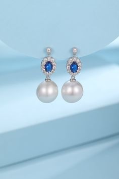 Royal Elegance Baroque Pearl Earrings - Inspired by Duchess Kate's Grace Embrace timeless sophistication with our 10-11mm Baroque Freshwater Pearl Earrings, exuding a royal charm reminiscent of Duchess Kate's iconic style. Each earring features a lustrous, white baroque pearl, perfectly paired with a striking blue gemstone. These earrings are a testament to enduring elegance, offering a touch of ceremonial grandeur for any occasion. Crafted with sterling silver, they boast a perfect color tone t Luxury Blue Sterling Silver Pearl Earrings, Formal White Gold Pearl Earrings With Gemstone, Teardrop Gemstone Pearl Earrings For Formal Events, Teardrop Gemstone Pearl Earrings For Formal Occasions, Formal Pear-shaped Pearl Gemstone Earrings, Teardrop Pearl Earrings With Gemstone For Formal, Pear-shaped Pearl Gemstone Earrings For Formal Occasions, Elegant Blue Pearl Earrings For Anniversary, Classic Baroque Pearl Earrings For Formal Occasions