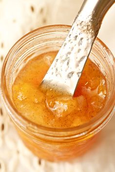 a spoon in a jar filled with liquid