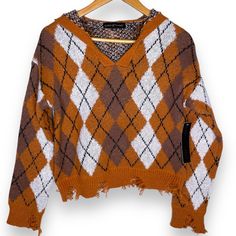 Almost Famous Distressed Ripped Fringe Argyle Plaid Cropped Hooded Sweater Medium New With Tags Rust Orange, Tan Brown, Black Oversized Slouchy Fit Fall Distressed Crew Neck Sweater, Brown Distressed Crew Neck Top, Orange Plaid Sweater, Rust Chenille Sweater, Brown Long Sleeve Argyle Sweater, Blush Pink Sweater, Cropped Cable Knit Sweater, Brown Cardigan, Boho Sweater