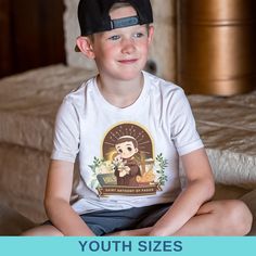 Introducing our "Saint Anthony of Padua Catholic Youth Shirt," designed to honor the beloved saint known for his role as a patron of lost things and a powerful intercessor. This shirt features a thoughtful depiction of Saint Anthony, making it an ideal choice for Catholic youth celebrating their faith. Crafted from soft, high-quality fabric, this shirt ensures comfort and durability for active kids. Its breathable material is perfect for daily wear, school, church, or any religious events. The d Boy First Communion, Anthony Of Padua, Lost Things, Saint Anthony Of Padua, Catholic Kids, First Communion Gifts, Saint Anthony, Active Kids, Youth Shirt