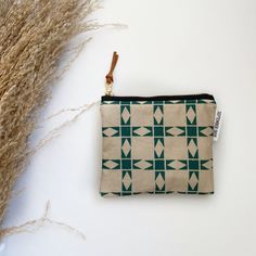 "Stash your odds and ends with this adorable square mini zipped pouch! As beautiful as it is functional, these bags are perfect for travel or everyday use! A mini first aid kit, a manicure set, jewelry holder or small makeup bag - it can be used for any organizational purpose!  Buy it for yourself or as a thoughtful gift to a friend or a family member! Makes a great gift paired with a gift card holder.  Specs: Approx 5\"x4\" Metall ykk zipper  Zipper is accented with a leather pull tag Lined with a coordinating cotton print  Machine Washable, hang dry" Square Pouch For Everyday Use, Green Rectangular Wallet With Zipper Pouch, Everyday Quilted Rectangular Pouch, Rectangular Quilted Pouch, Beige Coin Purse With Zipper Closure As Gift, Beige Rectangular Wallet With Zipper Pouch, Green Zipper Pouch Coin Purse As Gift, Square Zipper Pouch Cosmetic Bag For Daily Use, Rectangular Zipper Pouch For Gifts