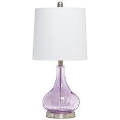 a purple glass table lamp with a white shade on the bottom and a silver base