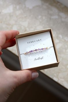 This dainty birthstone bracelet is made with natural amethyst gemstones, it is the perfect everyday bracelet. The bracelet is packed in a jewelry box and includes a description card of the gemstone, making it perfect for gifting ♥  ✦ MATERIALS: ~ Natural Amethyst gemstones (3-3.5mm) ~ Beading cord in beige ~ Accent Beads: 14k Gold Filled or 925 Sterling Silver ✦ SIZING: This bracelet is a one size fits all, adjustable with a braided macrame knot. Please note: The size of the stones may vary from Gift Amethyst Gemstone Beaded Bracelets, Amethyst Gemstone Beaded Bracelets For Gift, Amethyst Gemstone Beaded Bracelets As Gift, Amethyst Gemstone Beaded Bracelet Gift, Adjustable Amethyst Beaded Bracelets With Birthstone, Purple Birthstone Beaded Bracelets For Gift, Purple Birthstone Beaded Bracelets As Gift, Purple Beaded Birthstone Bracelets For Gift, Purple Beaded Birthstone Bracelets As Gift