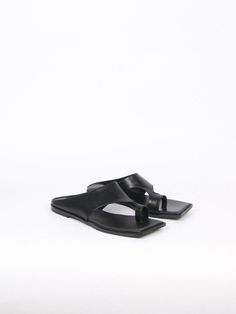 Editor's NotesThese edgy soft slides are made with the finest leather- Asymmetric silhouette- Toe ring- Stylish and comfy flat heels- LightweightMeasurements (in.)- Size: KR225(US5.5) - KR 255(US8.5)- Heel height: 0.4 in.- Fits true to the sizeComposition & Care- Cow leather, Pig Skin, Rubber Sole- Avoid water, oil, perfume, and makeup- When wet, don't wipe and dry while avoiding direct sunlight or heat- Use a colorless cloth to absorb moisture- Avoid color transferDesigner- Imported- by bla Modern Calf Leather Mules With Single Toe Strap, Modern Leather Slides With Flat Heel, Modern Black Toe Loop Sandals, Modern Slip-on Slides With Heel Loop, Modern Leather Footbed Slides For Formal Occasions, Modern Formal Slides With Leather Footbed, Modern Calf Leather Slides For Spring, Sleek Leather Slip-on Slides, Modern Leather Slides With Single Toe Strap