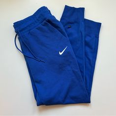 Never Worn! Nike Track Pants Blue, Blue Sports Bottoms With Pockets, Nike Blue Athleisure Joggers, Blue Sweatpants With Pockets For Sports, Blue Cotton Sportswear Bottoms, Blue Cotton Sportswear Pants, Blue Athleisure Pants With Pockets, Nike Blue Cotton Pants, Blue Sports Pants With Pockets