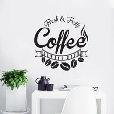 a wall decal that says fresh and juicy coffee makes breakfast on the table next to a white chair