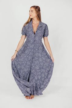 This gorgeous, feminine maxi is the easiest thing to wear for summer holidays and backyard barbeques. We love its lightweight ease and elegant floral pattern, and its front button placket gives it a classic quality you'll love wearing year after year. Available in two colorways. FIT: Runs true to size. MATERIAL: Viscose. GARMENT DETAILS: Lightweight floral maxi dress with a full front button placket, collared V-neckline, and short sleeves. Features a pleated front, in-seam pockets, and lining. S Summer Button-up Maxi Dress For Daywear, Button-up Maxi Dress For Summer Daywear, Spring Beach Button-up Maxi Dress, Summer Button-up Relaxed Fit Maxi Dress, Summer Maxi Dress With Relaxed Fit And Button-up, Summer Relaxed Fit Button-up Maxi Dress, Summer Button-up Maxi Dress For Beach, Chic Button-up Maxi Dress For Beach, Flowy Spring Maxi Dress With Button Closure