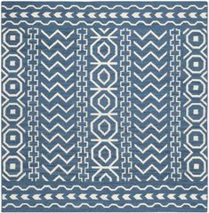 a blue and white rug with an intricate design