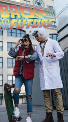 a man and woman standing next to each other in front of a building with a skateboard