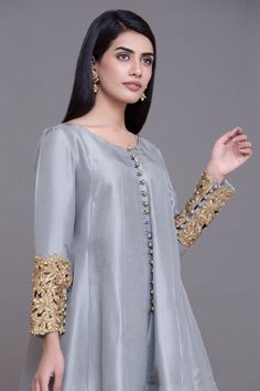 Simple Chiffon Suit for Party in Ice Blue Color with Magnificent Look emblazoned with beautiful embroidery, dabka and sequins. This party dress is unique in style and have classy look and perfect choice for wedding party. Frock: Short frock for party dress in ice blue color is embellished with fully copper color embroidery, dabka, nakshi, stones, cutdana, on full length sleeves. Fabric used for shirt is chiffon. Trouser: Stylish trouser in skin color is paired with this party dress. Trouser fabr Chiffon Suit, Embroidery Dresses, Short Frock, Ice Blue Color, Maxi Dress Designs, Stitching Ideas, Lace Dress Design, Pakistani Party Wear, Zari Embroidery