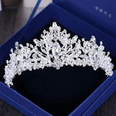 a tiara in a blue box on a table