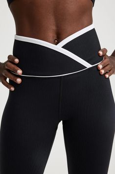 Our signature Veronica Leggings with a twist - this crossover-waistband style is ultra flattering and features a contrast binding for a fresh update to your next active look. Crossover waistband High waist Medium impact 25" inseam 9 3/4” rise Fabric: Active Rib - our signature fabric - ultra-flattering, smoothing, and moisture wicking active rib 85% Nylon 15% Spandex Machine wash cold, lay flat dry Made in the USA Cheap Women's Sportswear Leggings, Cheap Fitted Women's Legwear, Cheap Mid-thigh Length Activewear, Cheap Relaxed Fit Long Sleeve Activewear, Team Leggings, Meredith Blake, Athletic Wear Womens, Sporty Leggings, Activewear Trends