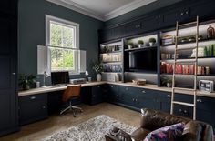 a home office with built in bookshelves and shelves