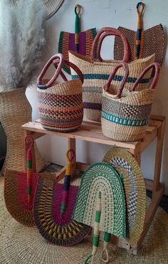 several baskets are stacked up on a shelf