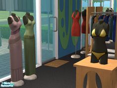 three mannequins are standing next to each other in front of clothing racks