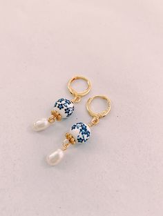 Dainty Blue Porcelain Pearl Gold Huggie Earrings Blue White | Etsy Blue Porcelain Jewelry, Gold And Blue Earrings, Artisan Blue Hoop Earrings As Gift, Handmade Blue Dangle Pearl Earrings, Artisan Handmade Pearl Earrings Gift, Handmade Blue Pearl Drop Earrings, Handmade Small Hoop Pearl Earrings For Gifts, Handmade Blue Pearl Earrings For Gift, Traditional Blue Hoop Earrings For Gift