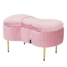 a pink bench with two round cushions on it's legs and one foot in the middle